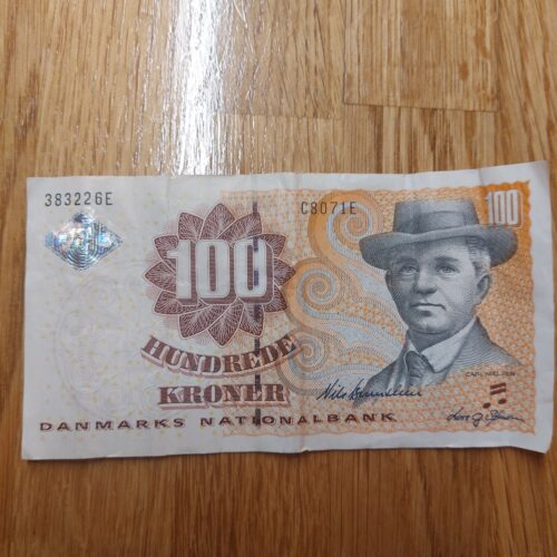 En glad fødevare-smiley og en udgået 100 kroneseddel